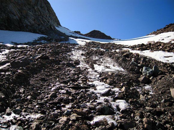 Piz Muragl - Sul ripido pendio di ghiaccio, ricoperto da detriti