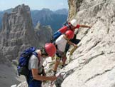 Via Normale Cima Both - In salita alla prima cengia, alle spalle la Croda Cimoliana